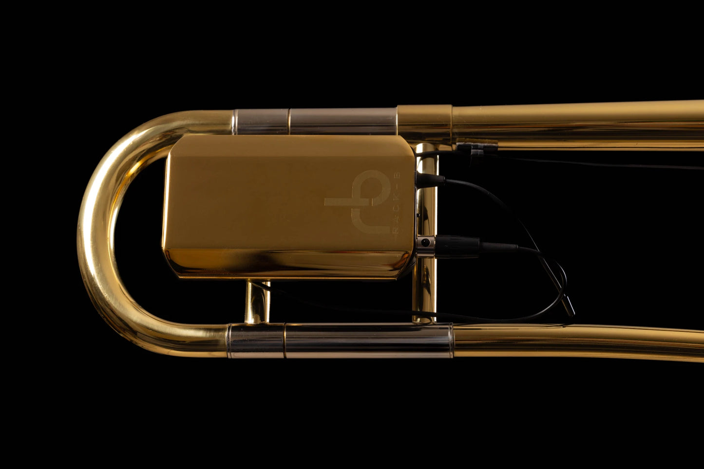 Émetteur avec le système d’accroche Rack-B sur un trombone + cache émetteur doré